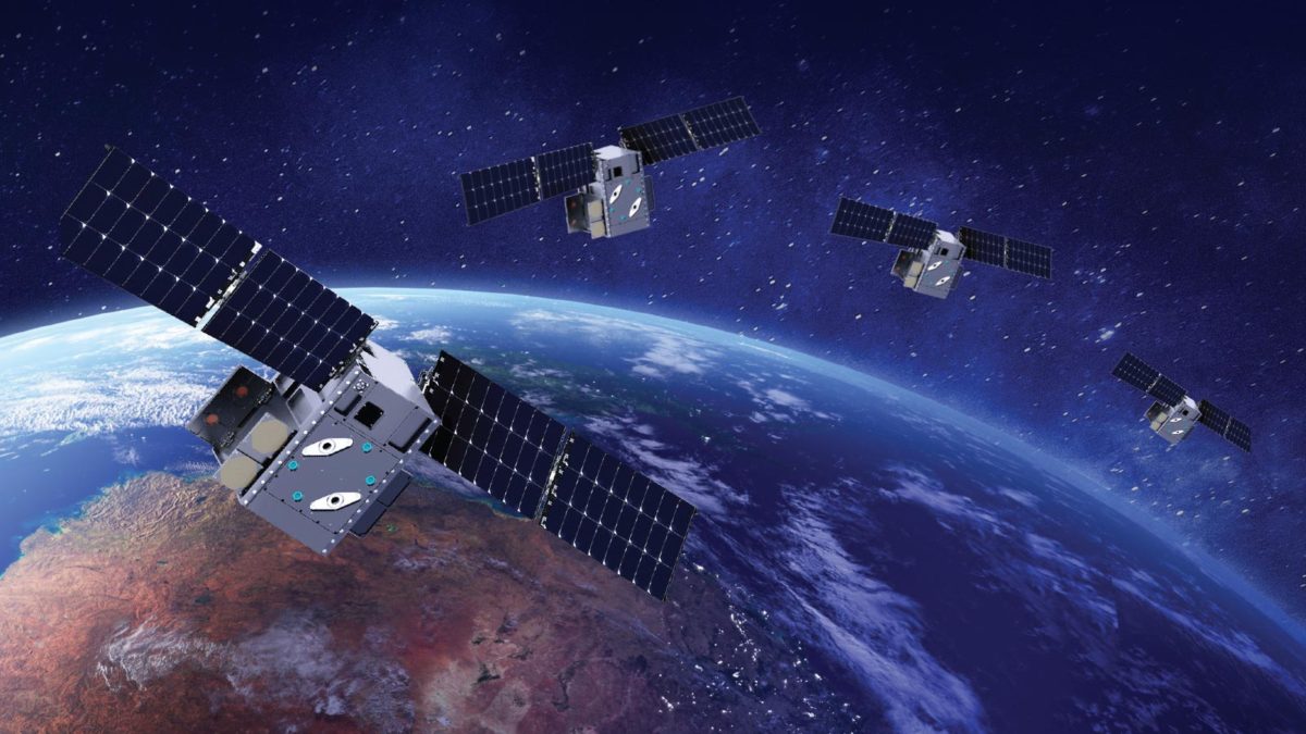 4 satellites in space hovering over part of planet earth