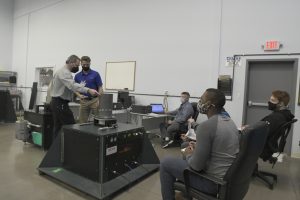 Participants attending a mass properties seminar in January 2022, discussing calibration technologies and solutions